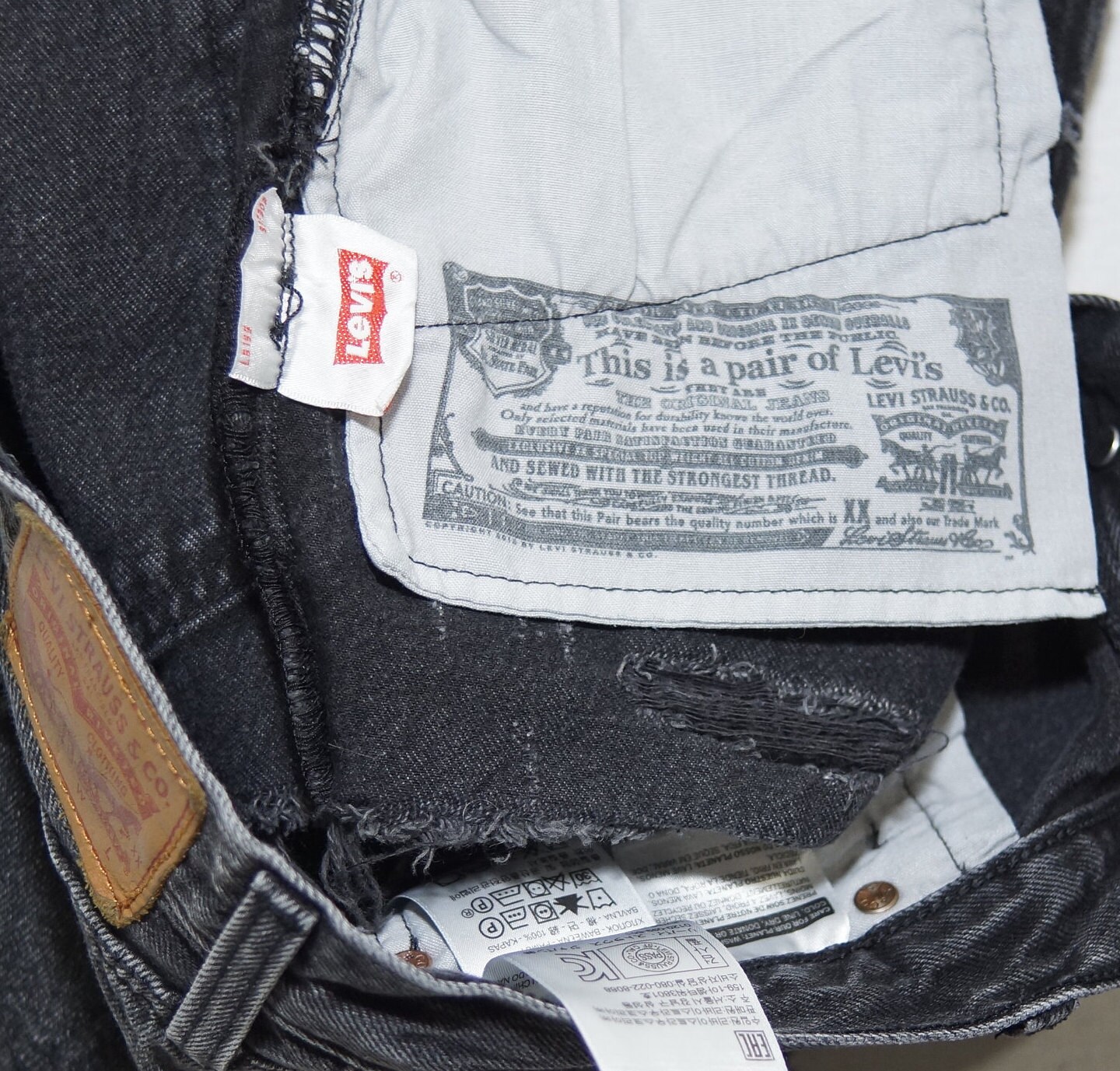 1990's Levi's Shorts Vintage 501 Jean Cutoffs Black Denim Button Fly Fringe Hem Daisy Dukes 30 waist