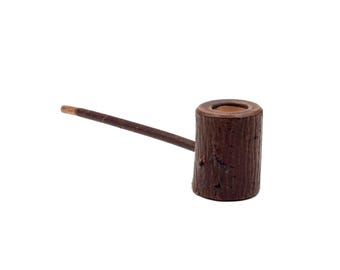 May include: A handcrafted wooden pipe with a dark brown finish. The pipe features a cylindrical bowl and a long, slender stem. The bowl has a textured, bark-like appearance, and the stem is smooth. The pipe is designed for smoking.