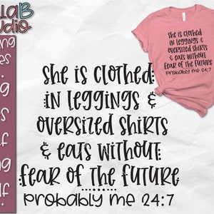 May include: A pink t-shirt with black text that reads "She is clothed in leggings & oversized shirts & eats without fear of the future probably me 24:7".