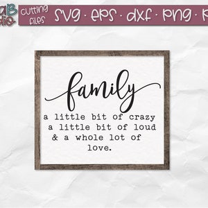 May include: A framed sign with the word "family" in a cursive font. The sign also includes the text "a little bit of crazy, a little bit of loud, & a whole lot of love."