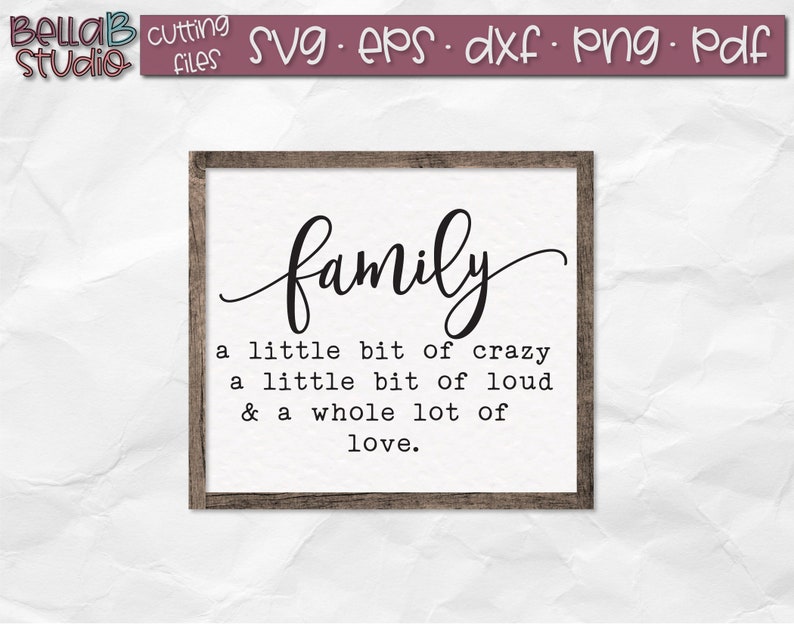 May include: A framed sign with the word "family" in a cursive font. The sign also includes the text "a little bit of crazy, a little bit of loud, & a whole lot of love."