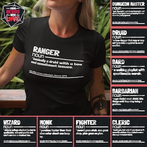 May include: A black t-shirt with white text that defines different Dungeons and Dragons character classes. The text includes the words "Ranger", "Druid", "Bard", "Barbarian", "Wizard", "Monk", "Fighter", and "Cleric".