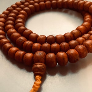 Nepal Bodhi Seed Mala with Guru bead and an adjustable knot. 108 bead necklace with Phoenix Eye guru bead for Japa Mala