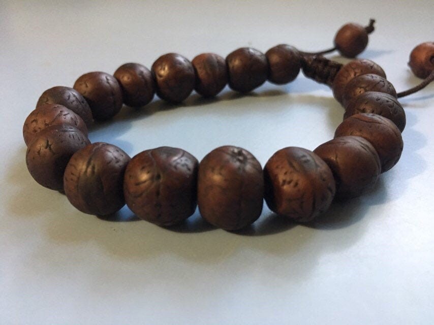 Men's Mala bracelet. Bodichitta Bodhi seeds on nylon and an adjustable knot