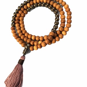 Sandalwood and Hematite mala necklace.  108 beads plus a Hematite Guru Bead and cotton tassel.  Great for meditation, Boho, Hippie fashion