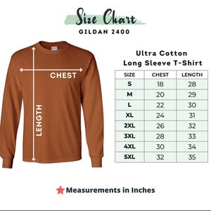 Puede incluir: Una camiseta de manga larga de color &oacute;xido con una tabla de tallas. La tabla muestra las medidas de pecho y largo en pulgadas para las tallas S a 5XL. Tambi&eacute;n se ve el texto "Ultra Cotton Long Sleeve T-Shirt".