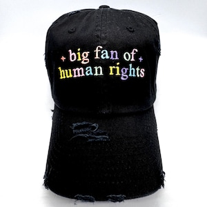 May include: A rustic wooden sign with the text "Welcome to our home" in white lettering. The sign features a distressed finish and a simple, inviting design, perfect for front door decor.