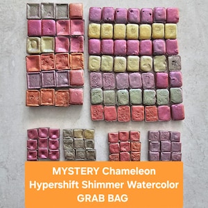 May include: A set of three ceramic mugs with a speckled, matte finish in cream, light brown, and dark brown. Each mug has a simple, minimalist design, ideal for tea or coffee.