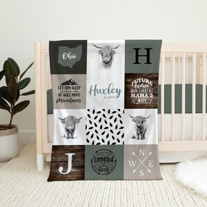 May include: A patchwork baby blanket with various square designs. The blanket features images of a Highland cow, the Ohio state outline, and text including "Huxley James", "Let Him Sleep He Will Move Mountains", and "Future Ladies Man Current Mama's Boy".
