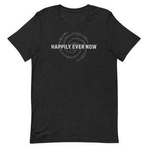 May include: A dark heather grey t-shirt with a white graphic of a spiral design and the text "Happily Ever Now".