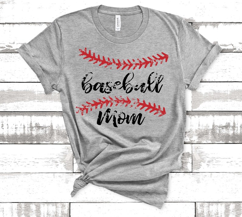 May include: Gray t-shirt with the text "baseball mom" in black lettering and red baseball stitching above and below the text.