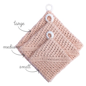 May include: Three crocheted pot holders in different sizes, labelled "small", "medium", and "large". The pot holders are a light peach colour with white crocheted loops.