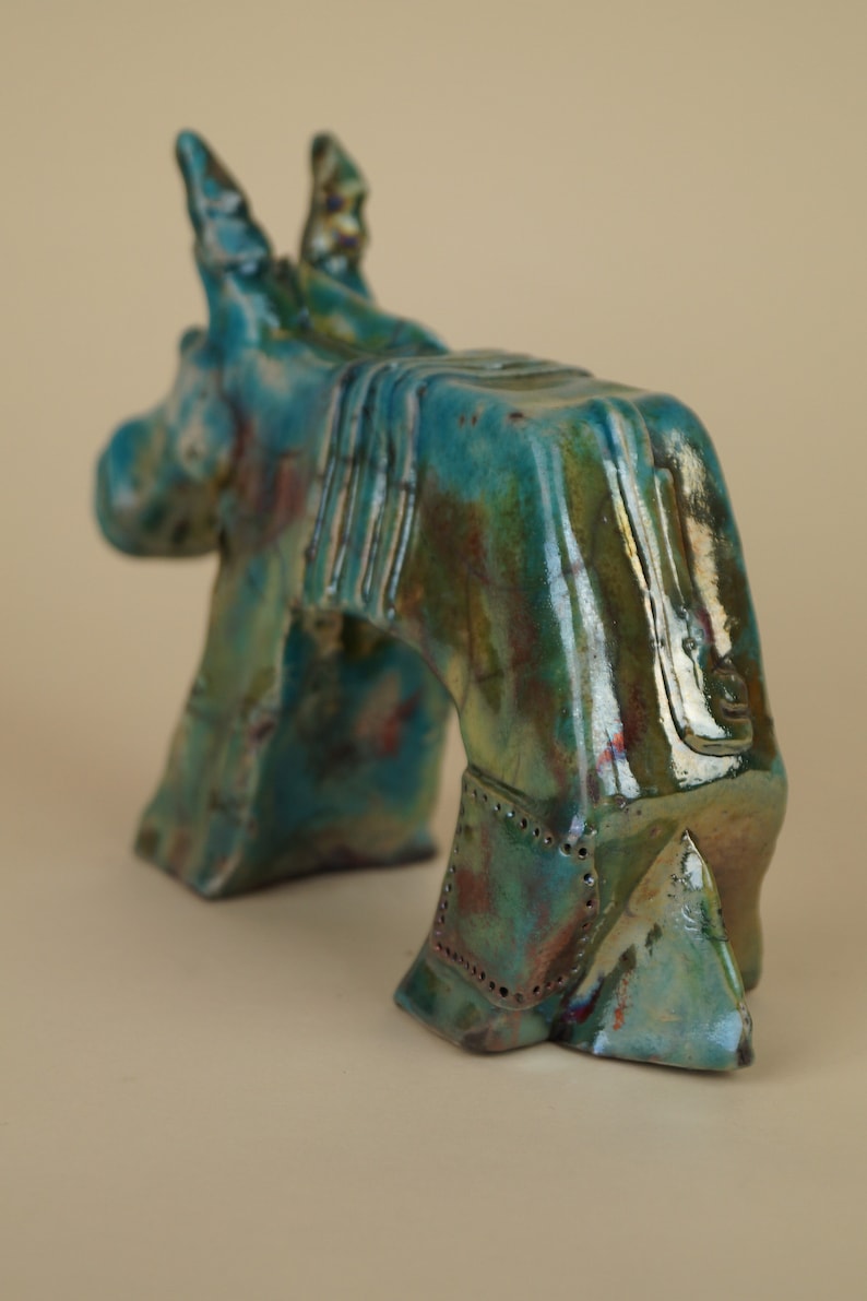 Ceramic donkey figurine fired in raku