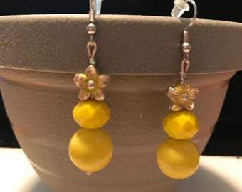 Yellow earrings with flower charm