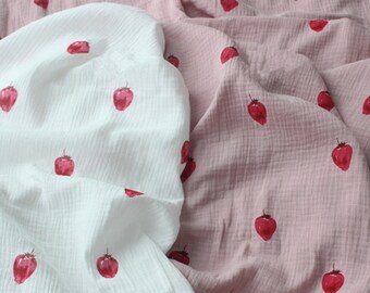 May include: Two pieces of fabric with a strawberry print. One piece is white and the other is pink.
