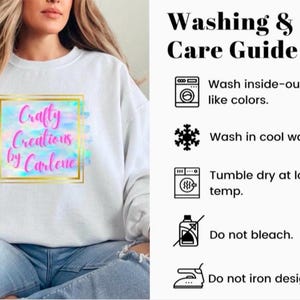 May include: White sweatshirt with the text "Craftly Creations by Carlene" in a colorful design. The image also includes a washing and care guide with instructions to wash inside-out, in cool water, and tumble dry at low-temp.
