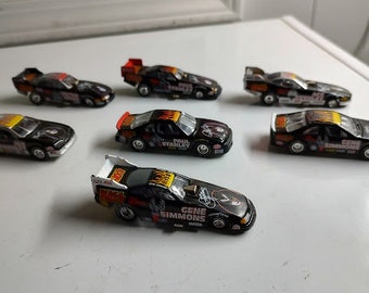 Seven KISS Johnny Lightning Cars