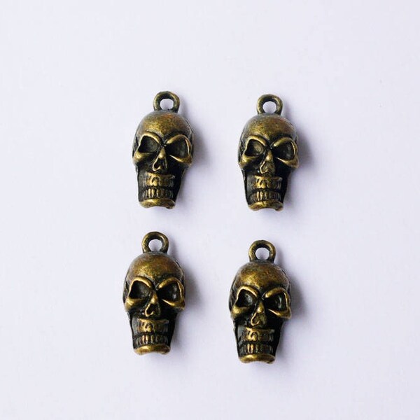 4 Pendentifs  bronze "Tête de mort" couleur bronze