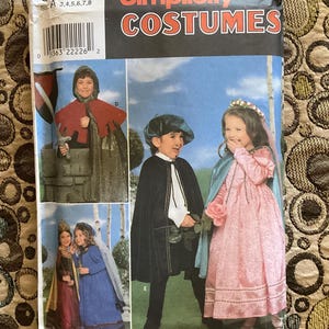 May include: Simplicity Costumes sewing pattern for children's costumes. The pattern includes a knight, a princess, and a page. The pattern number is 0644.