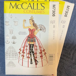 May include: Two McCall's Costumes sewing patterns for a red and black corset and a large hoop skirt. The pattern numbers are M7306 and the sizes are A5 (6-8-10-12-14) and E5 (14-16-18-20-22).