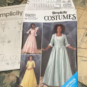 May include: Simplicity pattern S9251 for a historical costume. The pattern includes instructions for making a dress with a fitted bodice and a full skirt. The pattern is available in sizes 14-22. The pattern is shown on a model wearing a light blue dress.