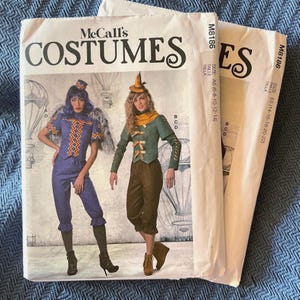May include: Two sewing patterns for costumes, McCall's Costumes, pattern number M8186. The patterns are for sizes A5 (6-8-10-12-14) and E5 (14-16-18-20-22).