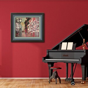 May include: A framed painting of a city street scene with a clock tower and a building with a flower-filled window box. The painting is in a black frame and is hanging on a red wall. A black grand piano with the word "Music" on it is in the foreground.