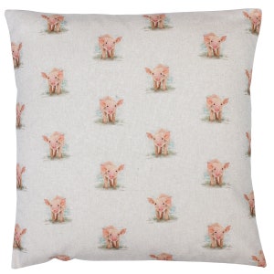 May include: A white cushion with a repeating pattern of pink piglets. The piglets are facing forward with their snouts pointed towards the viewer.