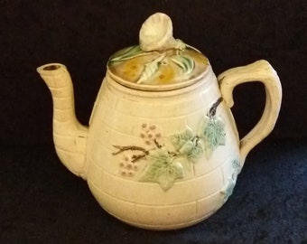 Antique Majolica ivy on brick circa 1880s teapot with a morning glory finial.