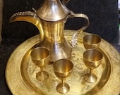Vintage Middle Eastern DALLAH coffee pot.etched brass with beautifully decorated brass plate and 4 cups. Turkish .Islamic coffee pot set