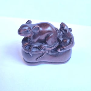 Vintage finely detailed hand-carved boxwood mice sitting on a shoe netsuke intricate design  ,representing harvest and wealth.signed to base