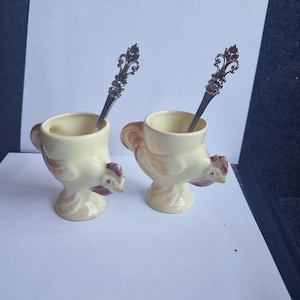 Fun pair vintage 1920,30s Rooster egg cups. With new matching spoons. Sweet vintage collectibles.