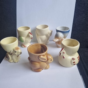 Fun vintage 1920,30s egg cups. With new matching spoons. Sweet vintage collectibles.sold separately
