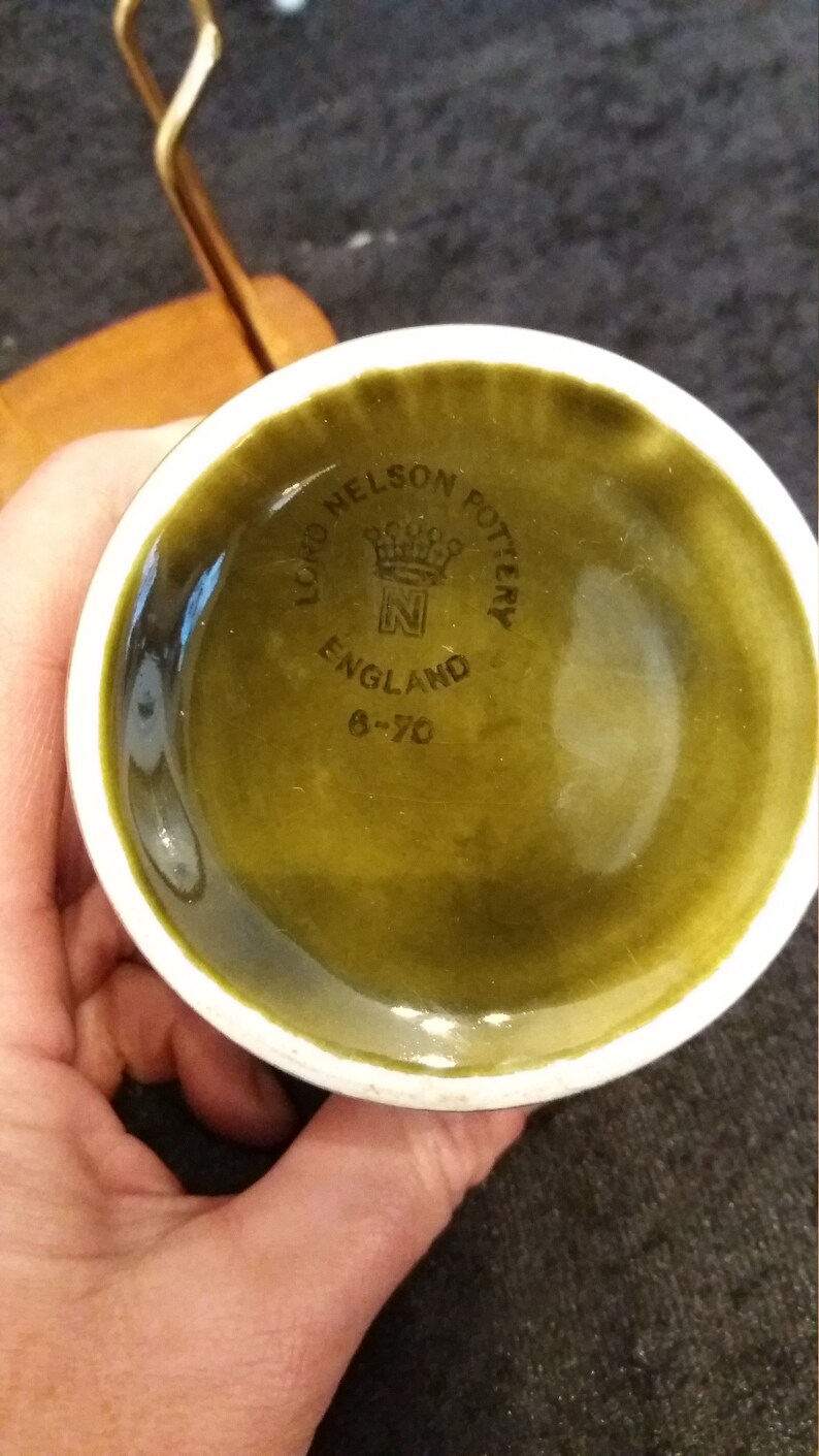 lovely sage green embossed honey.preserve or marmalade pot vintage Lord Nelson pottery and Wyncraft hopefully in its original wooden stand