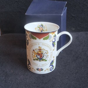 Royal Doulton commemorative twin handled loving mug.Margeret Thatcher the first female prime minister of the United Kingdom 1979.