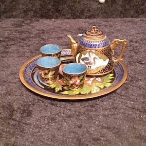 Vintage miniature Cloisonne enamelled teapot set on a tray.