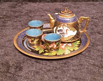 Vintage miniature Cloisonne enamelled teapot set on a tray.