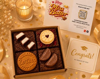May include: A square cardboard box containing four dark chocolate brownies topped with various cookies and candies, accompanied by a Hey Miss Butter informational card with a QR code and a gold-lettered Congrats graduation greeting card.
