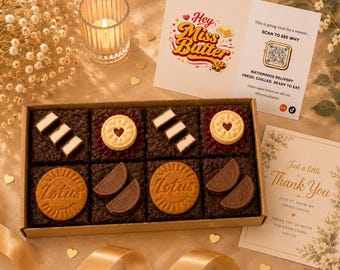 May include: A rectangular cardboard box containing eight dark chocolate brownies topped with various cookies, including Lotus Biscoff and heart-centered biscuits. Two printed cards accompany the box, one featuring the text Hey Miss Butter and a QR code.