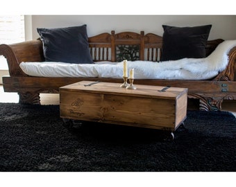 Coffee table made of wooden crate, freight crate, wooden chest with vintage casters