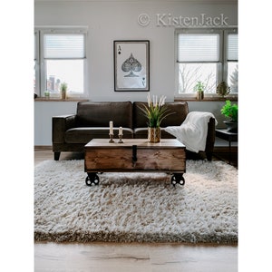 Vintage coffee table &quot;Pur&quot; on cast iron castors