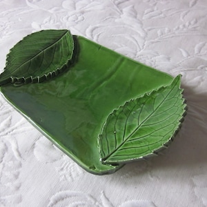 Ramekin or decorative pocket in painted and glazed terracotta.