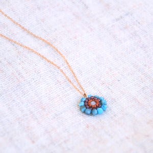 The stainless steel chain I chose for this pendant is rose gold, but I can always personalize your necklace with other chain colours or materials. All the pieces are made by order, so length and colour can be custom-made.