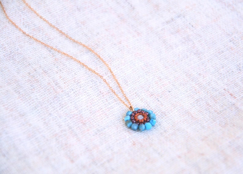 The stainless steel chain I chose for this pendant is rose gold, but I can always personalize your necklace with other chain colours or materials. All the pieces are made by order, so length and colour can be custom-made.