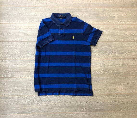 blue polo shirt with yellow horse