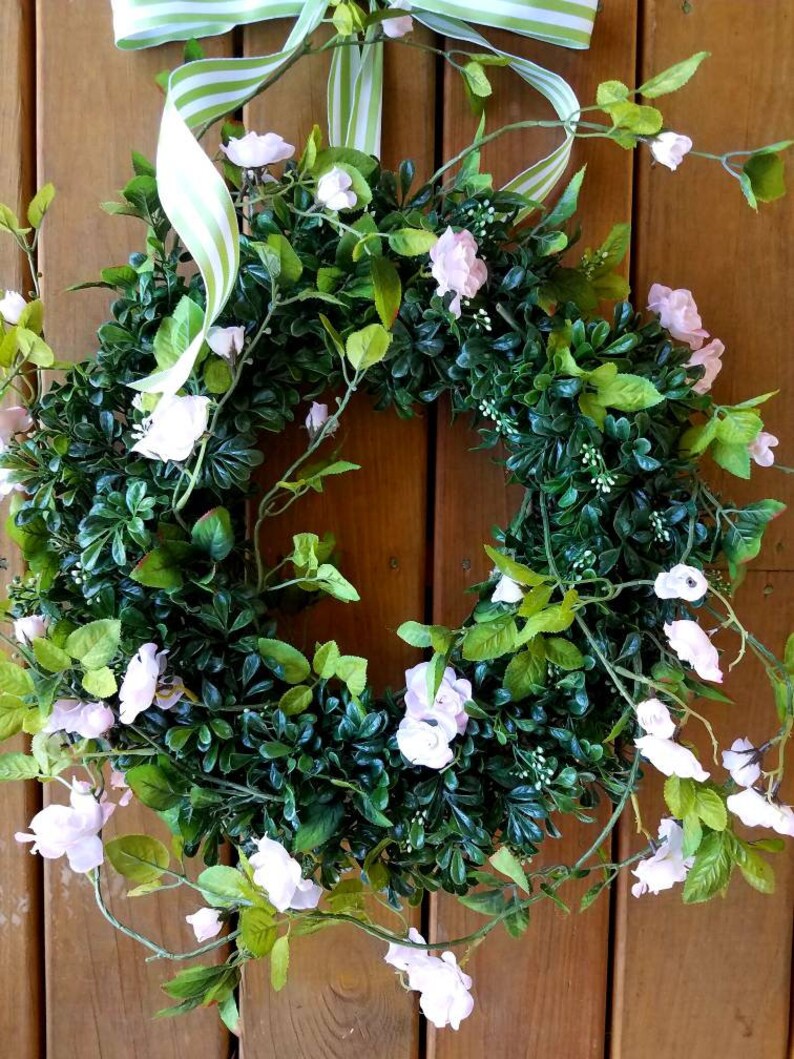 Faux boxwood and wild roses wreath