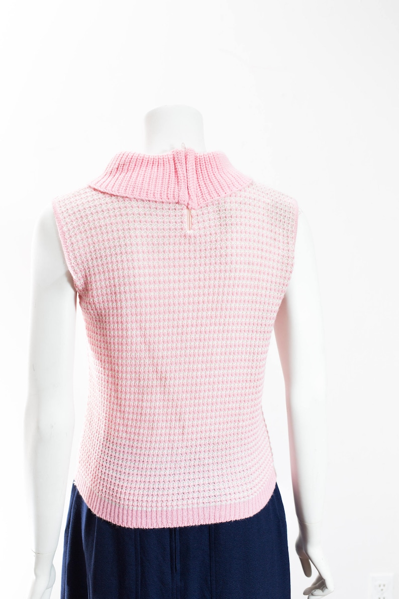 pink and white sweater vest