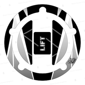 May include: A black and white gas tank cap with a silver 'LIFT' inscription. The cap has a geometric pattern with diagonal lines and a circular design.