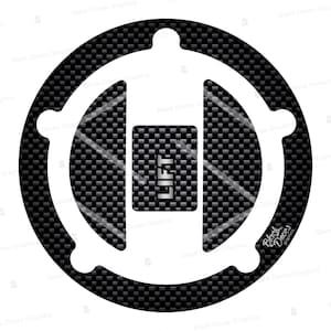May include: A black and white motorcycle gas tank protector with a carbon fiber pattern and the word "LIFT" in a white rectangle.