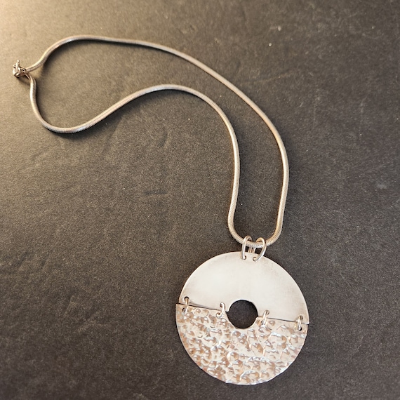 Sterling Silver Articulated Disk Pendant